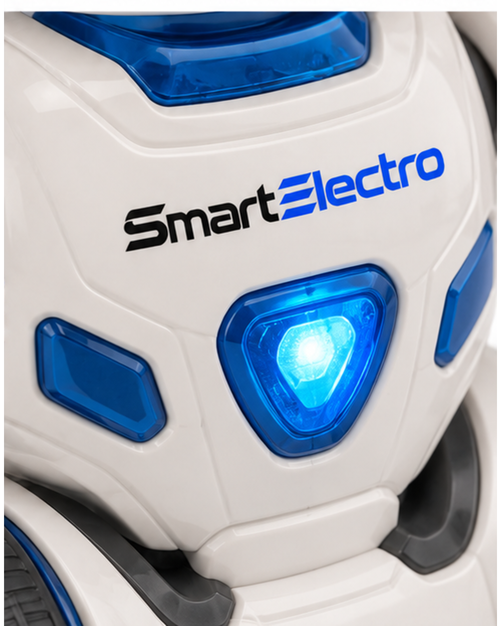 Close-up of the SmartElectro branding and blue chest light on the dancing robot toy