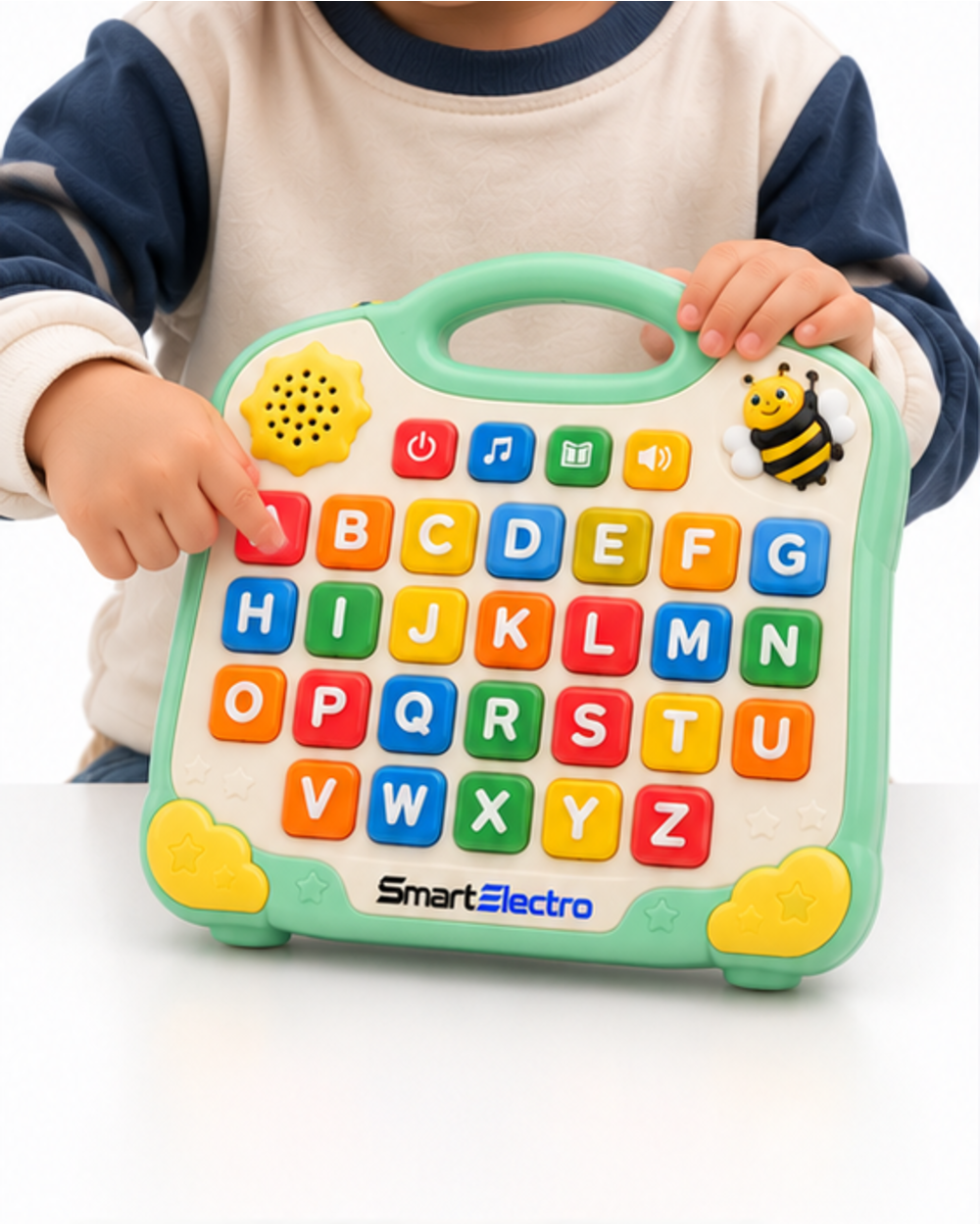 Child pressing a letter button on the SmartElectro alphabet learning board