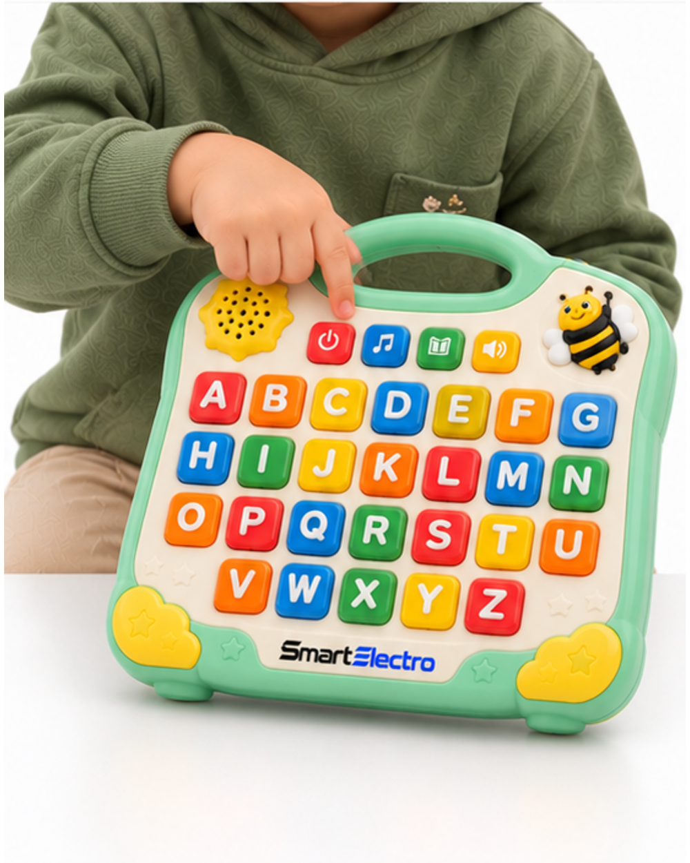 Child pressing the power button on the SmartElectro alphabet learning board