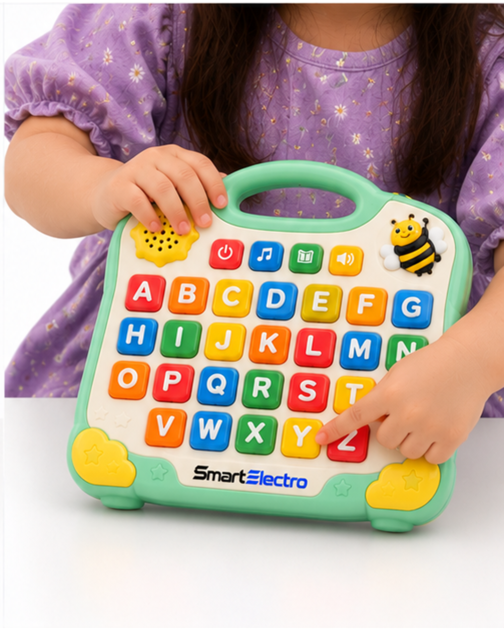 Child pressing the letter Z on the mint green alphabet learning board