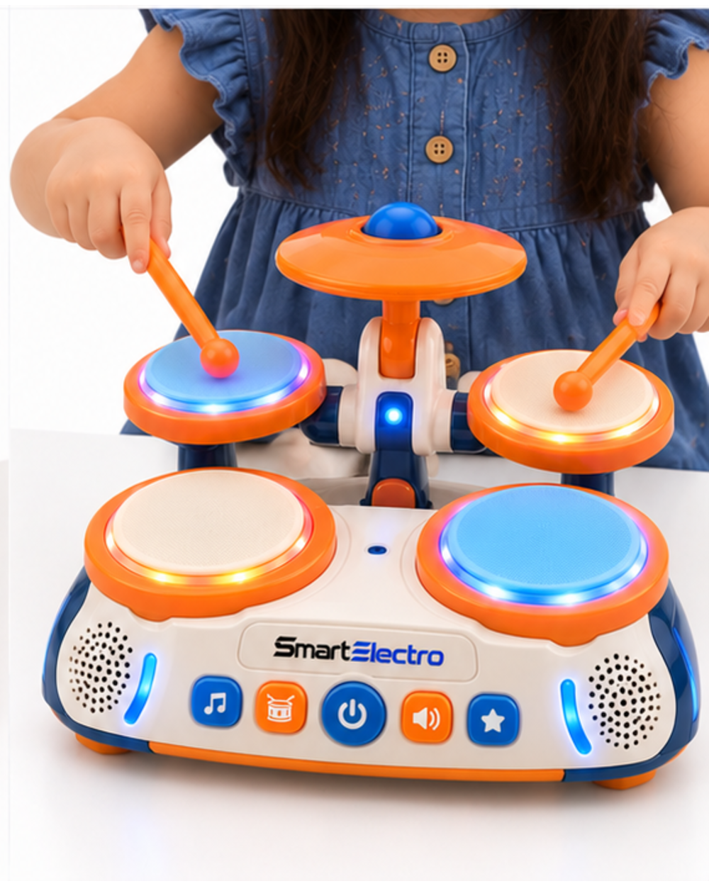 Child hitting the drum pads of the bright orange toy drum set, angled view